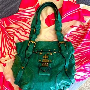 Beautiful green, leather Juicy couture bag with gold accents.